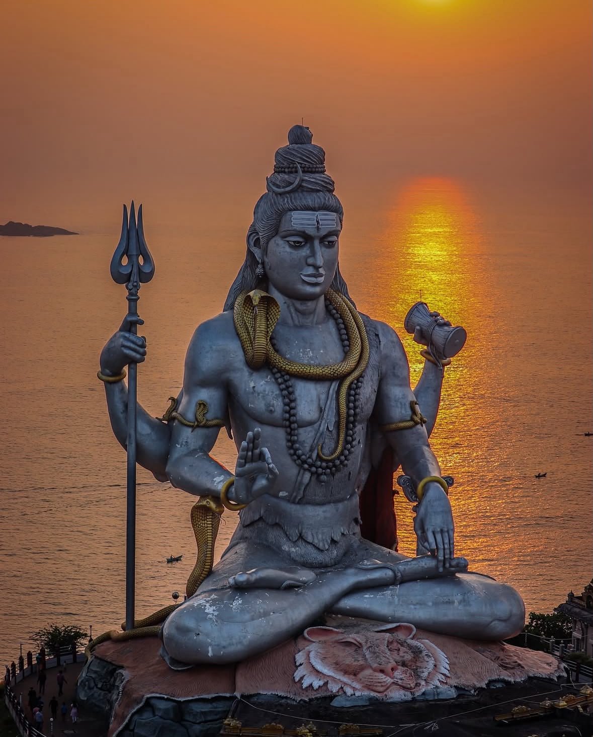 Murudeshwar Karnataka — towering Shiva statue at golden sunset with dramatic sky over the Arabian Sea
